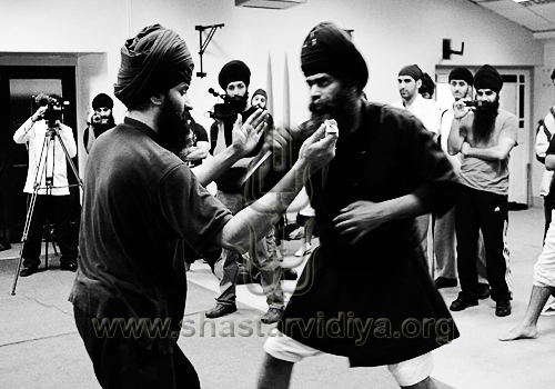 Nidar Singh Nihang demonstrating traditional blade techniques, Birmingham